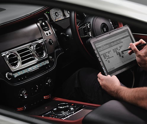 Mechanic checking electronics