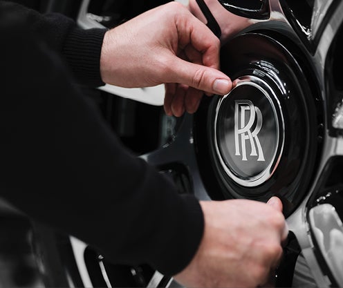Mechanic working on wheels and tire
