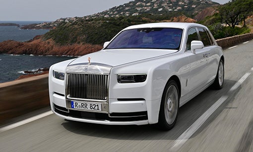 person driving Phantom Extended over long bridge