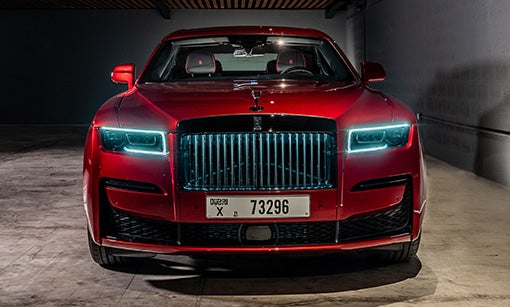 Black Badge Red Ghost parked in dim lit garage